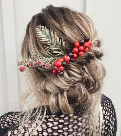 An updo styled with holiday berries