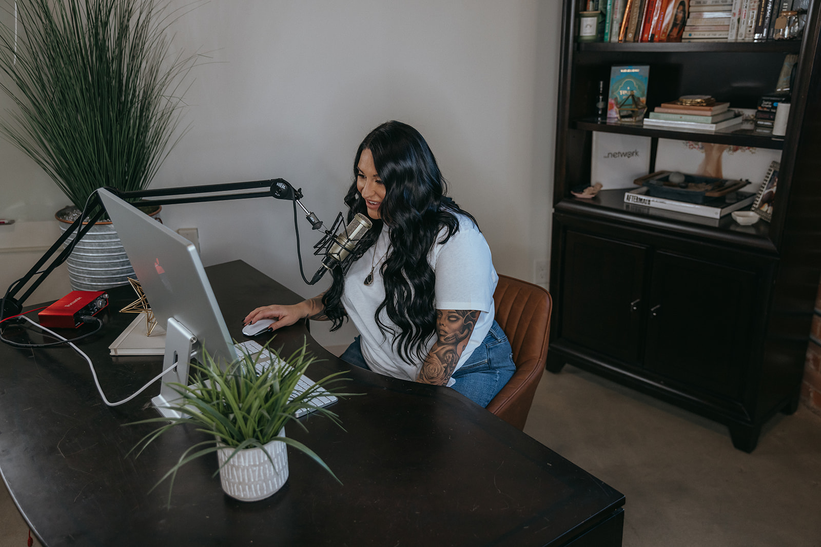 Gina recording an episode of her podcast.