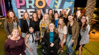 PBA Executive Summit attendees posing together at cocktail event in front of a PBA banner.
