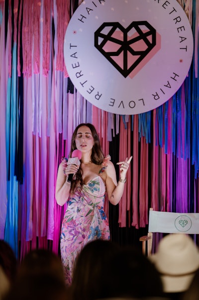 Elizabeth Faye speaking at Hair Love University.