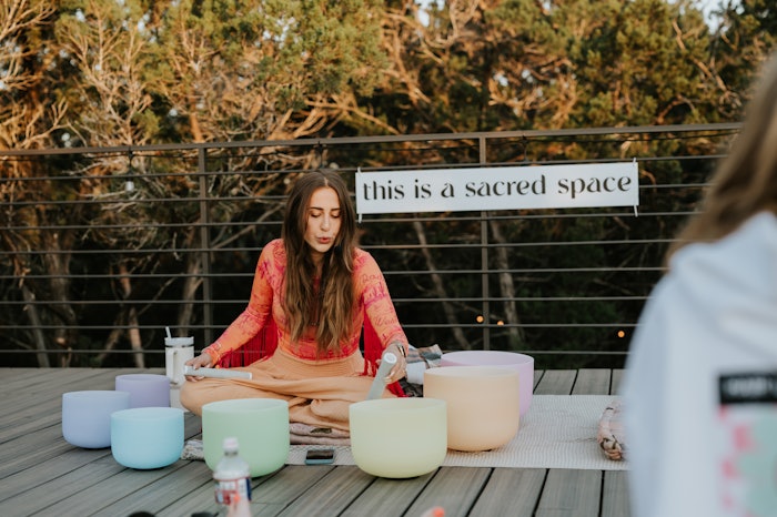 Elizabeth Faye practices breathwork at a retreat.