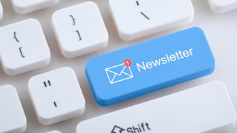 Keyboard with blue newsletter button.