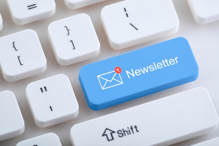 Keyboard with blue newsletter button.
