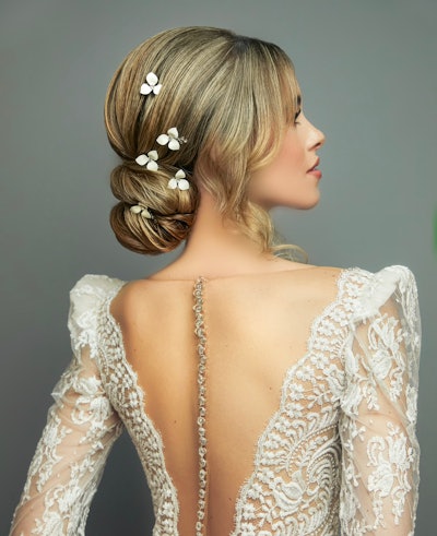 Caidy's Chic Bridal Bun with Floral Accessories