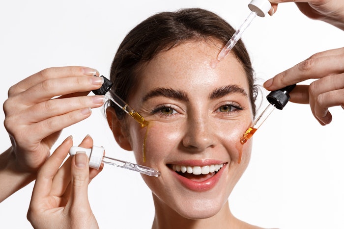 woman trying various serums skin care concept