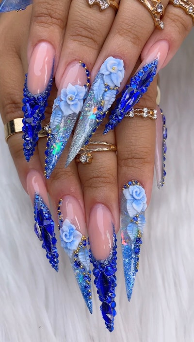 Blue nails with acrylic flowers