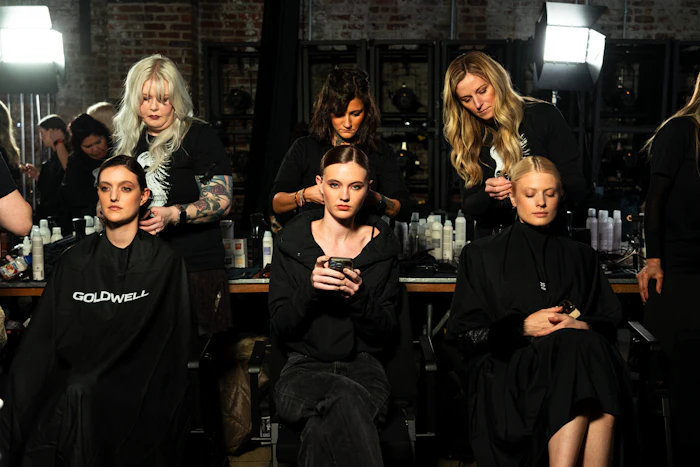 Yui Noto NYFW Show, where Goldwell served as the hair team sponsor. Here, three Goldwell artists each style a model's hair for the runway.