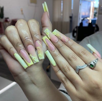 Yellow nails with 3D floral nail art by @nailedbysandi