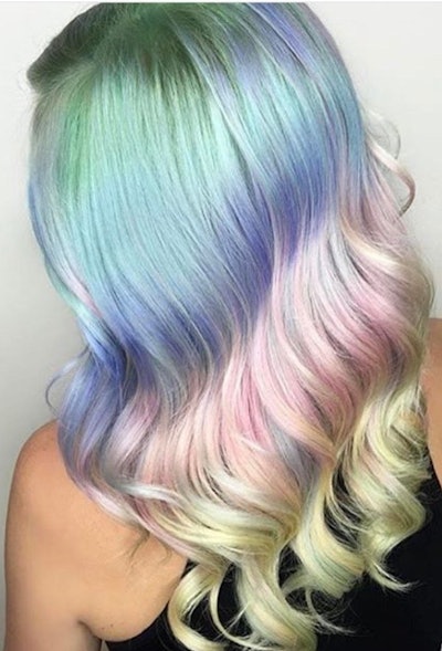 Pastel colored hair with green at the roots, fading into blue, purple, pink then yellow.