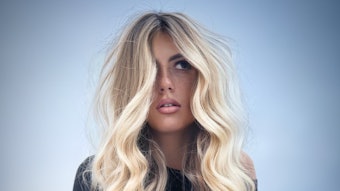 A TREND Model sporting wavy, blonde hair.
