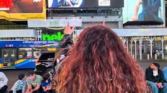 Sherette looks at TREND The Brand billboard in Times Square.