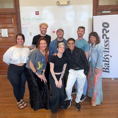 Attendees smile for a picture after Joel Torres' class!