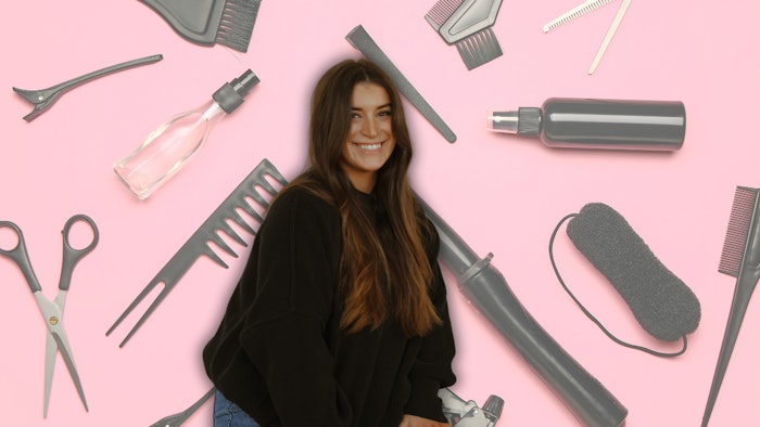 Emily Stephens headshot against a pink background covered in hair tools.