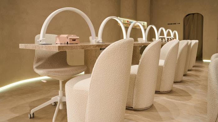 Labo Beauté nail salon interior featuring nail lamps, curing lamps and salon chairs.