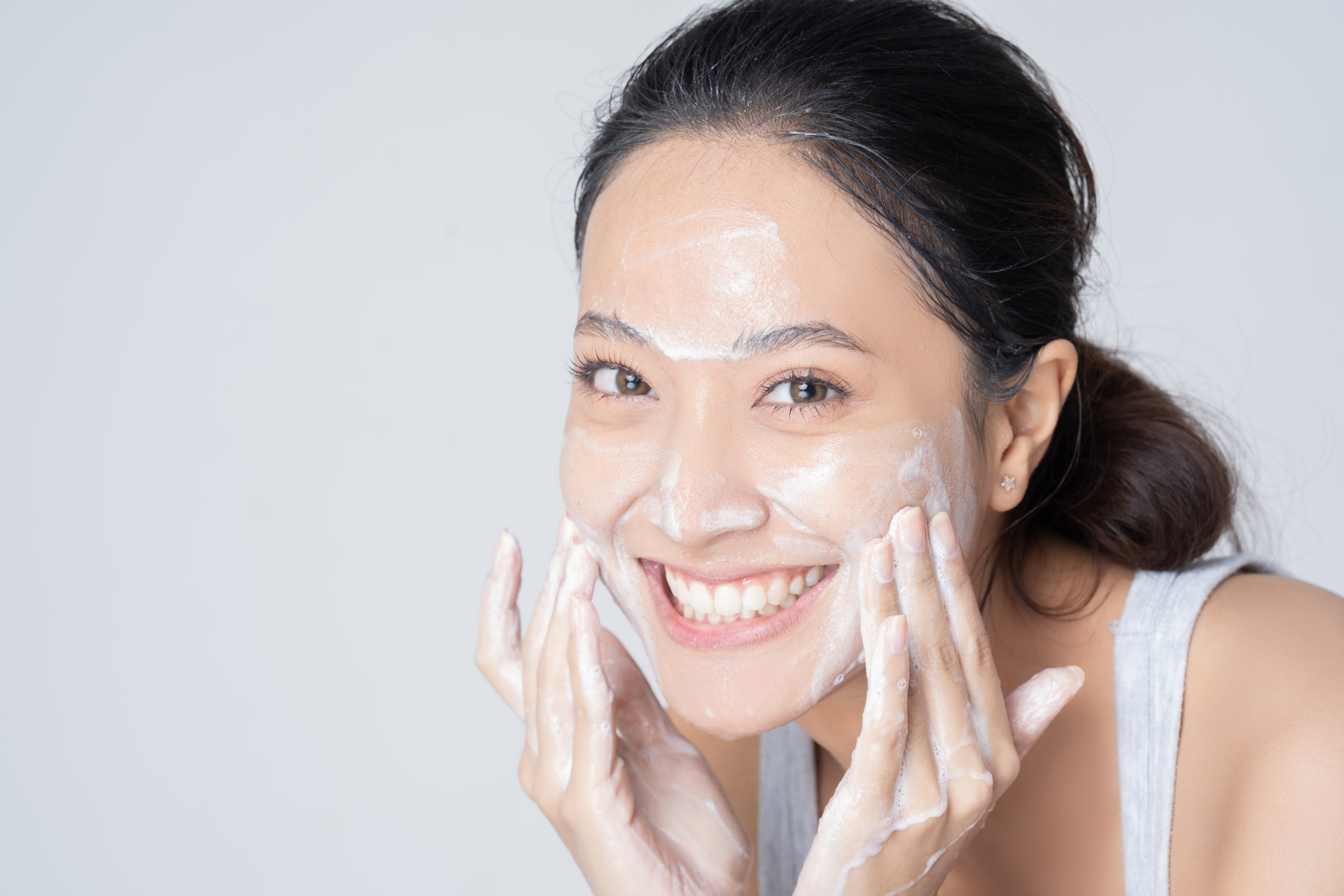Beautiful Asian Woman Washing Face Smiling Foam Cleanser Adobe Stock 370774077