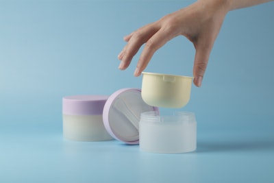 ICONS America's refillable monomaterial PP jar features a built-in spatula housed in the inner cap.