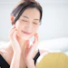 Jd Jojoba Beautiful Young Woman Relaxed Feeling Her Face Mirror Adobe Stock 1014461013