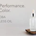 JD Jojoba Colorless Oil bottle with dropper on natural wood surface, advertising high-performance skincare product