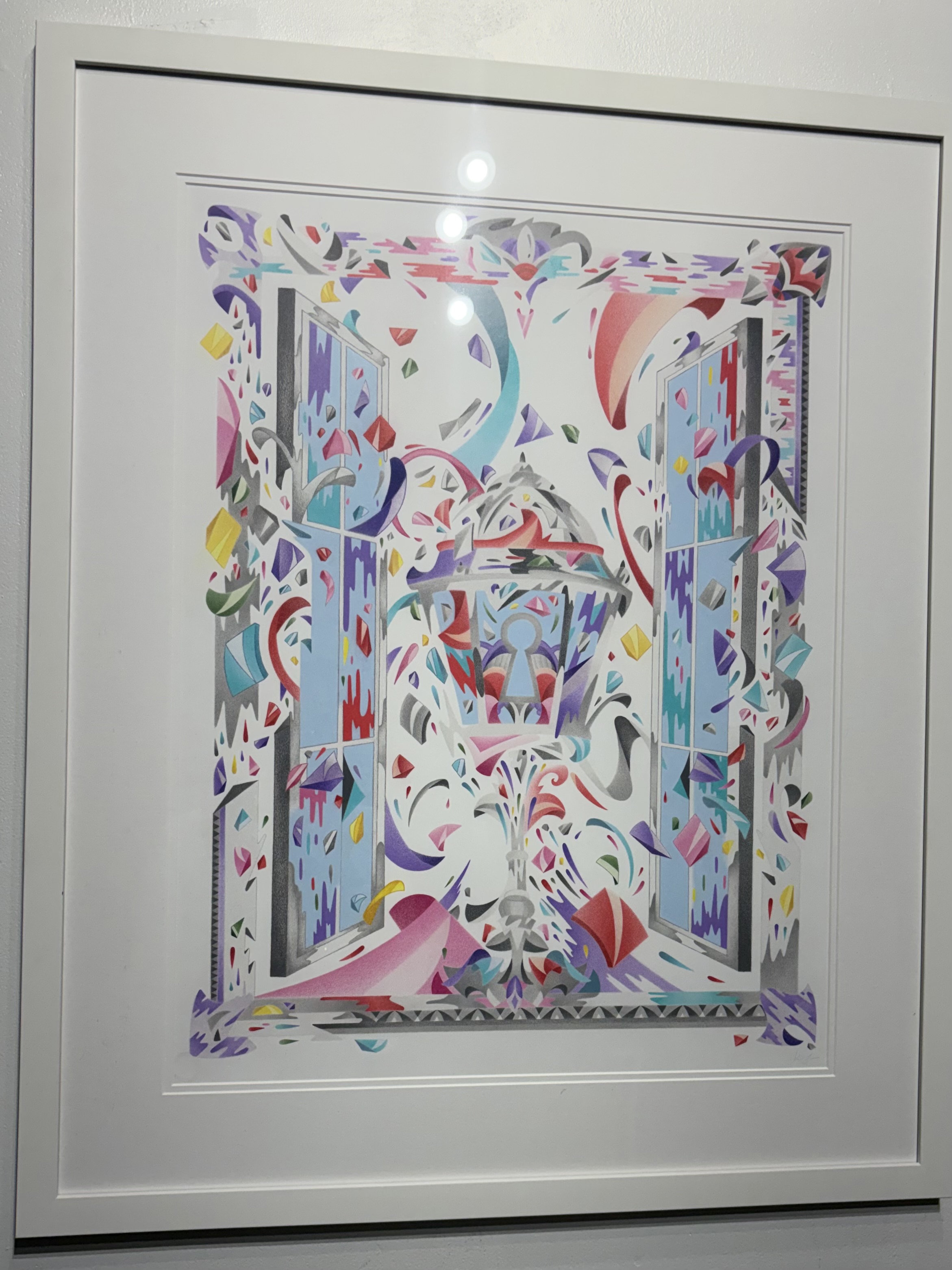 Colorful abstract framed artwork featuring geometric shapes and ribbons flowing through an open window design